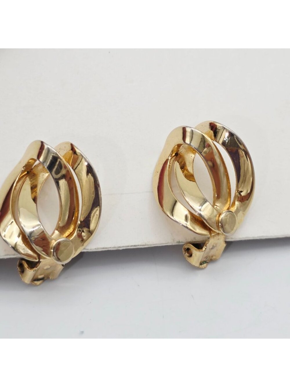 Vintage Gold-Tone Clip-On Earrings With Abstract Swirl Design 1"